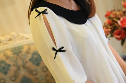 **มีตำหนิ** เสื้อตัวบน ผ้าชีฟองเนื้อทราย เปิดเว้าช่วงแขน + แต่งโบว์ มีซับใน สีขาว ขาว