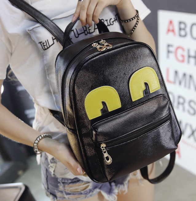 กระเป๋าเป้ หนังสีดำ แต่งลูกตาสีเหลืองน่ารัก พร้อมส่ง black