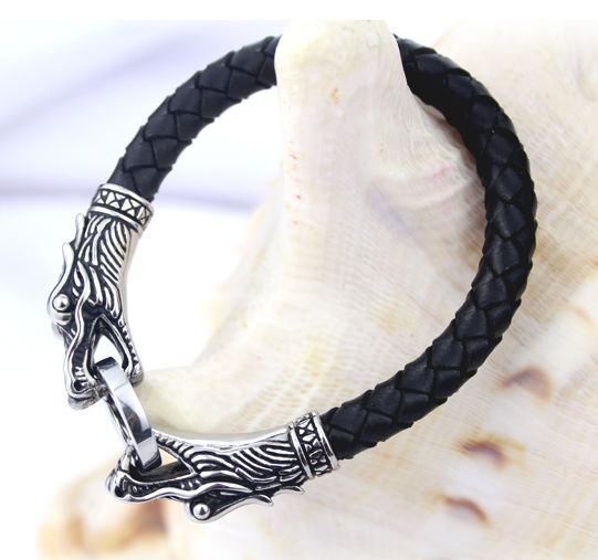 สร้อยข้อมือผู้ชาย หนังแท้ สีดำ ดีไซน์ เป็น หัวมังกร เงิน คาบห่วง 2 หัว ตัวสายสร้อยข้อมือ ทำเป็นหนังถัก สร้อยข้อมือ เสริมบารมี no 285701
