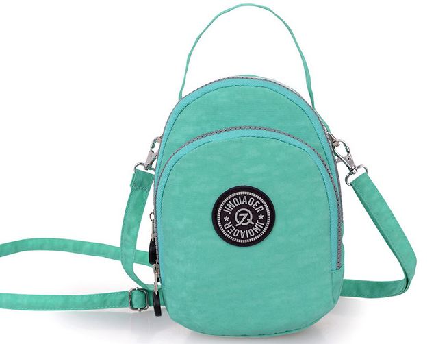 กระเป๋าสะพายผู้หญิง กระเป๋าสะพายข้าง ใส่ของกระจุกกระจิก ใส่เงิน ขนาดเล็ก กระเป๋าผ้าไนลอน กันน้ำ ดีไซน์ เป็นรูปไข่ รูปวงรี มี 3 ช่องซิป น่ารักค่ะ 34598